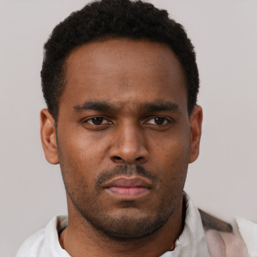 Neutral black young-adult male with short  brown hair and brown eyes
