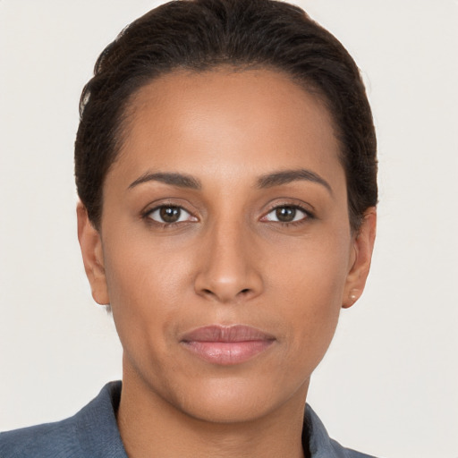 Joyful latino young-adult female with short  brown hair and brown eyes