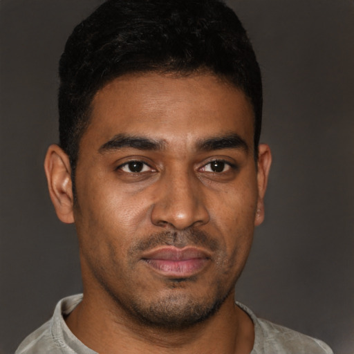 Neutral latino young-adult male with short  black hair and brown eyes