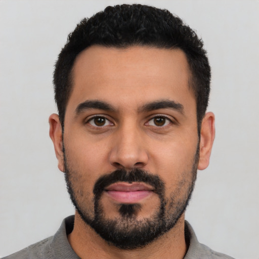 Neutral latino young-adult male with short  black hair and brown eyes