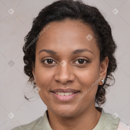 Joyful black adult female with medium  brown hair and brown eyes