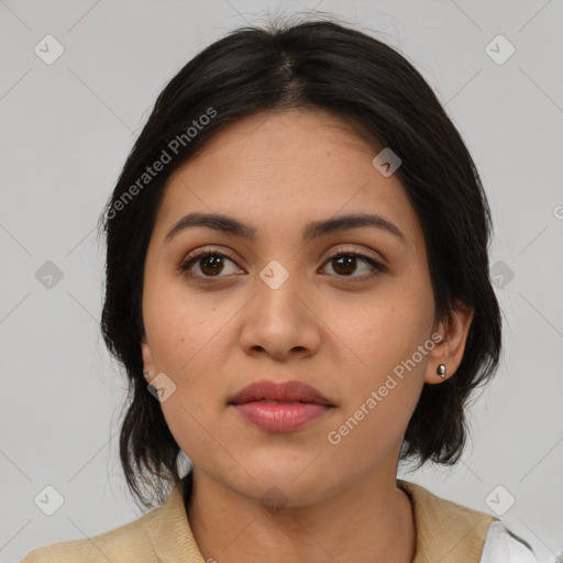 Joyful latino young-adult female with medium  brown hair and brown eyes