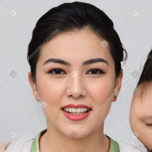 Joyful asian young-adult female with medium  black hair and brown eyes