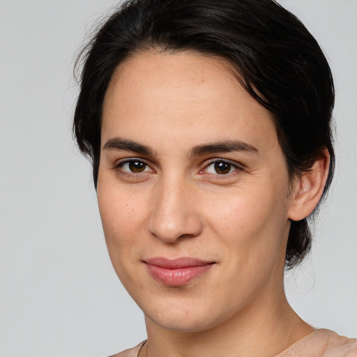 Joyful white young-adult female with medium  brown hair and brown eyes