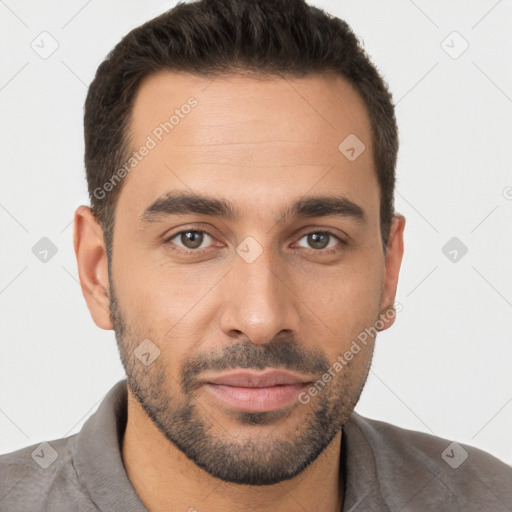 Joyful white young-adult male with short  brown hair and brown eyes