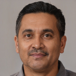 Neutral latino adult male with short  black hair and brown eyes