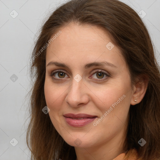 Joyful white adult female with long  brown hair and brown eyes