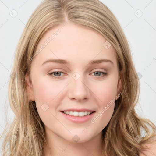 Joyful white young-adult female with long  brown hair and blue eyes