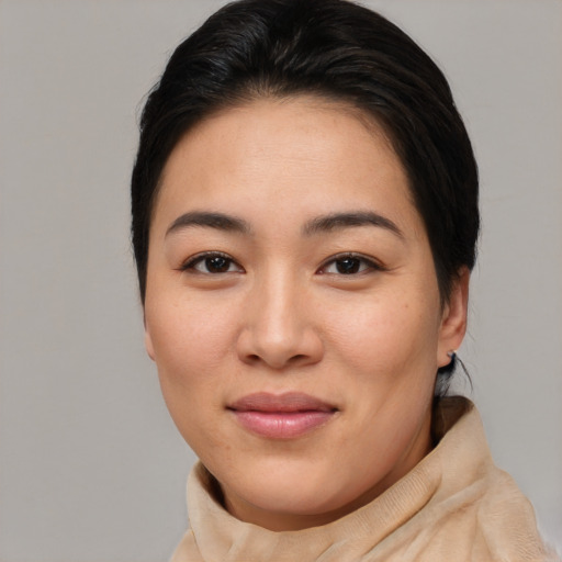 Joyful asian young-adult female with short  brown hair and brown eyes
