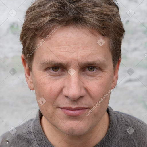 Joyful white adult male with short  brown hair and grey eyes