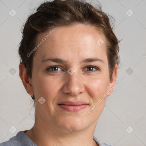 Joyful white adult female with short  brown hair and grey eyes