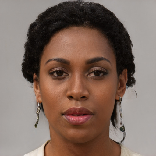 Neutral black young-adult female with short  black hair and brown eyes