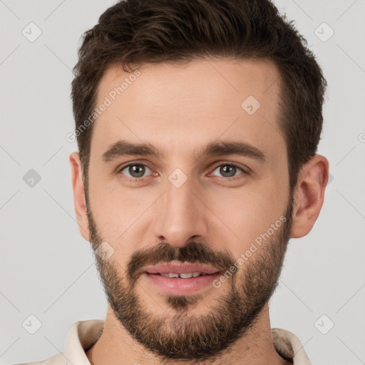 Joyful white young-adult male with short  brown hair and brown eyes