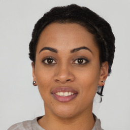 Joyful latino young-adult female with short  black hair and brown eyes