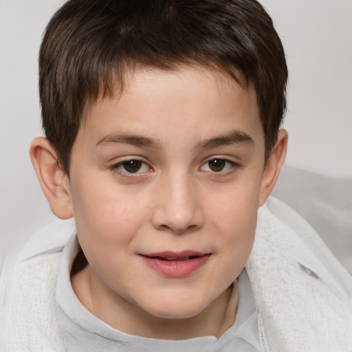 Joyful white child male with short  brown hair and brown eyes