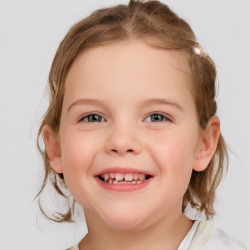 Joyful white child female with medium  brown hair and blue eyes