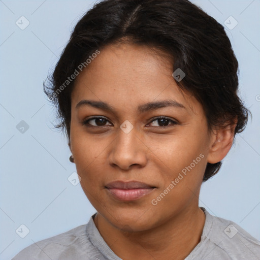 Joyful latino young-adult female with short  brown hair and brown eyes