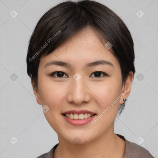 Joyful asian young-adult female with short  brown hair and brown eyes