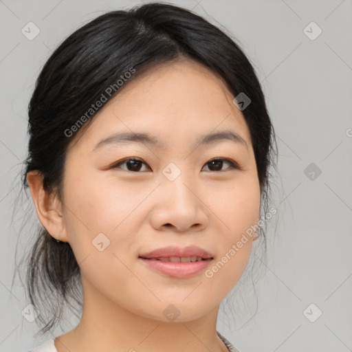 Joyful asian young-adult female with medium  black hair and brown eyes