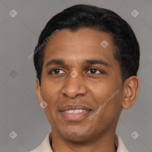 Joyful latino young-adult male with short  black hair and brown eyes