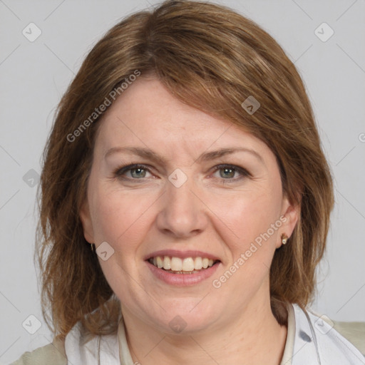 Joyful white adult female with medium  brown hair and grey eyes