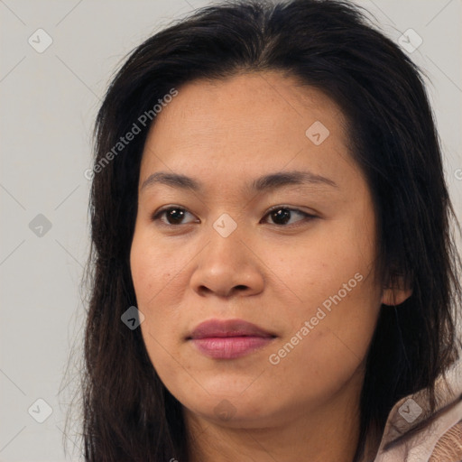 Joyful asian young-adult female with long  brown hair and brown eyes