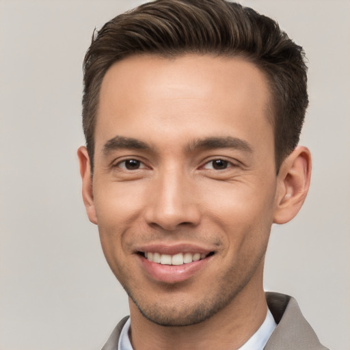 Joyful white young-adult male with short  brown hair and brown eyes