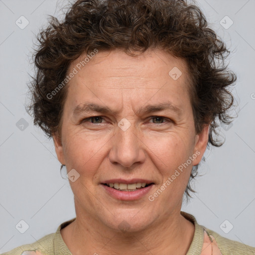 Joyful white adult female with short  brown hair and brown eyes