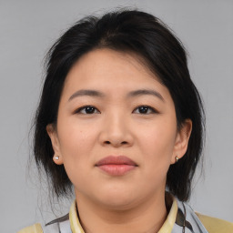 Neutral asian young-adult female with medium  brown hair and brown eyes