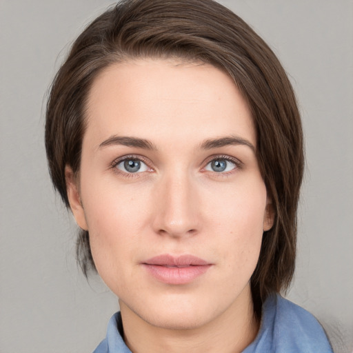 Neutral white young-adult female with medium  brown hair and grey eyes