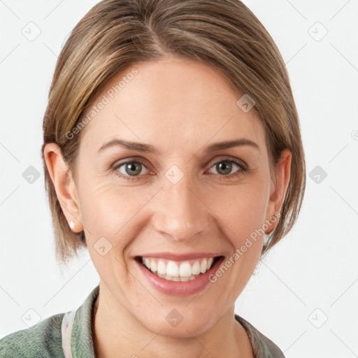 Joyful white young-adult female with medium  brown hair and grey eyes