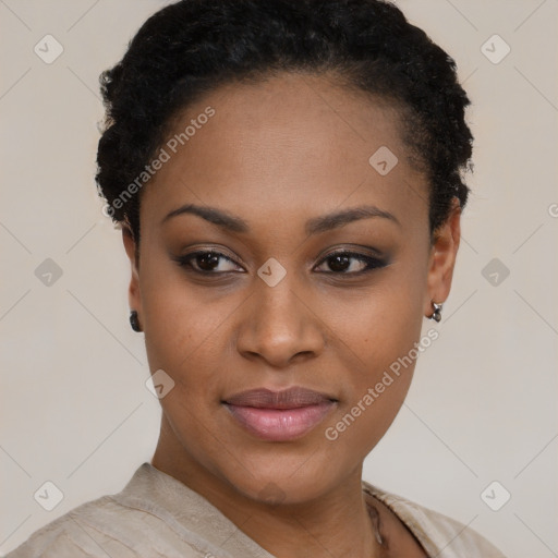 Joyful black young-adult female with short  black hair and brown eyes