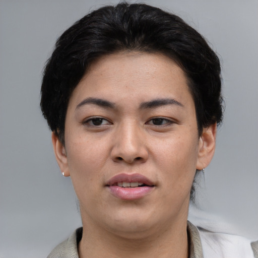Joyful asian young-adult female with short  brown hair and brown eyes