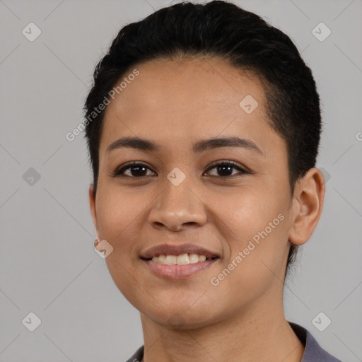 Joyful latino young-adult female with short  black hair and brown eyes