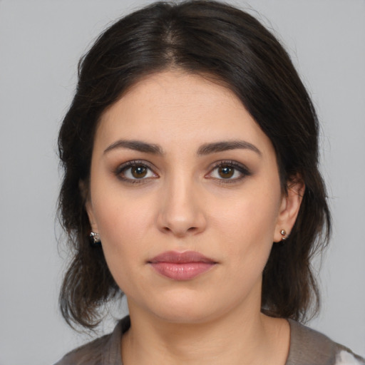 Neutral white young-adult female with medium  brown hair and brown eyes