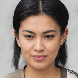 Joyful asian young-adult female with medium  black hair and brown eyes