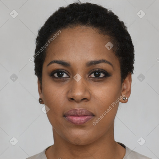 Joyful black young-adult female with short  black hair and brown eyes