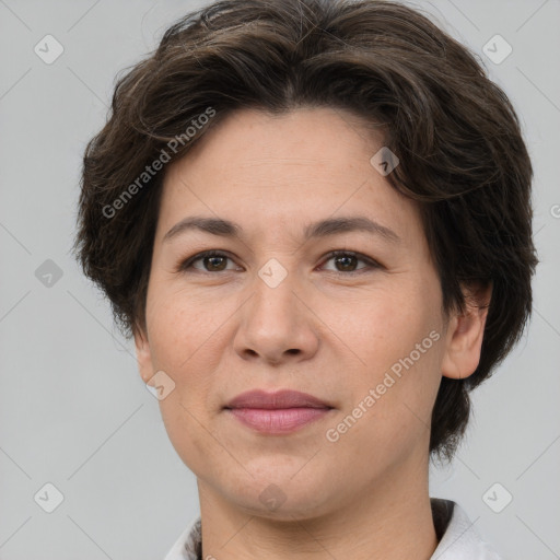 Joyful white adult female with short  brown hair and brown eyes