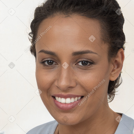 Joyful white young-adult female with short  brown hair and brown eyes