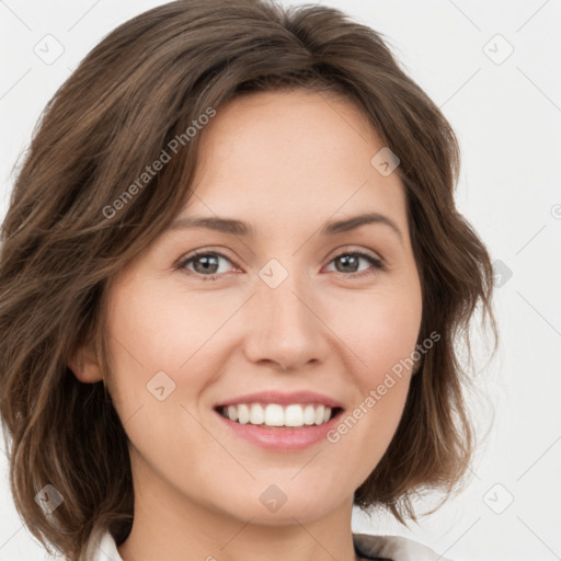 Joyful white young-adult female with medium  brown hair and green eyes