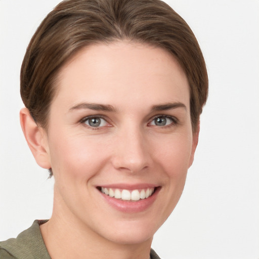 Joyful white young-adult female with short  brown hair and grey eyes