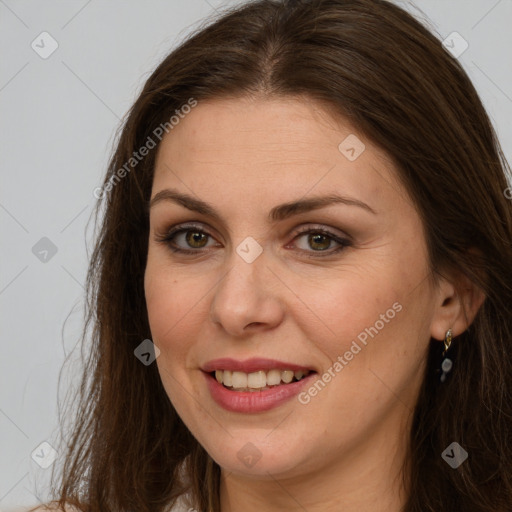 Joyful white young-adult female with long  brown hair and grey eyes