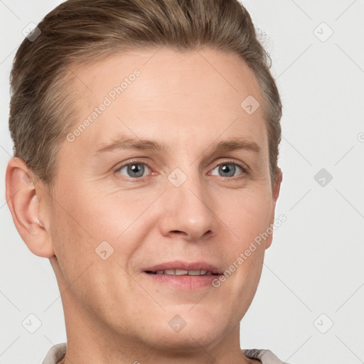 Joyful white adult male with short  brown hair and grey eyes