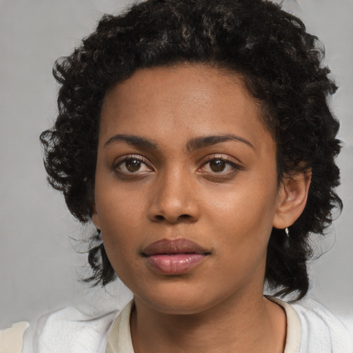 Neutral black young-adult female with medium  black hair and brown eyes