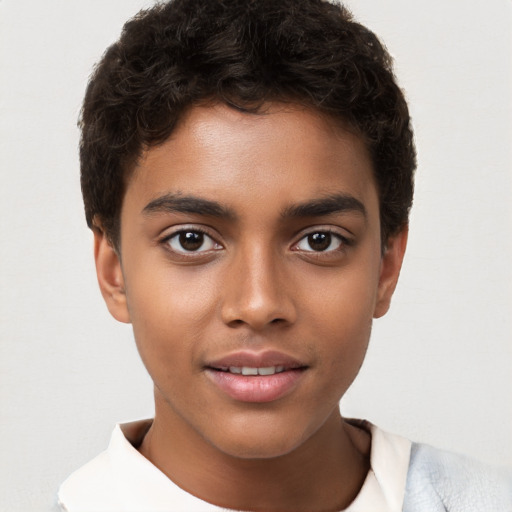 Joyful white child male with short  brown hair and brown eyes