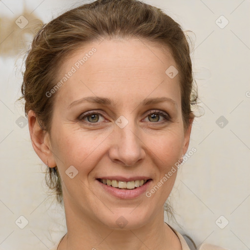 Joyful white adult female with medium  brown hair and green eyes