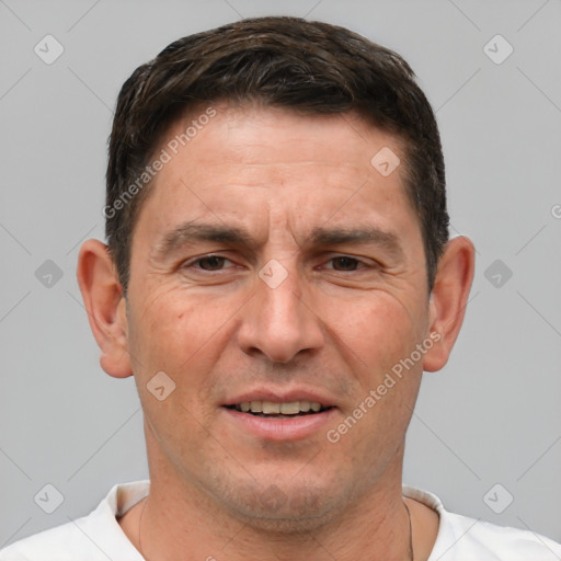 Joyful white adult male with short  brown hair and brown eyes