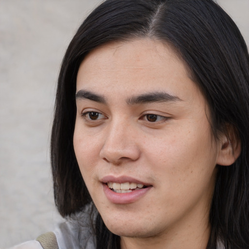 Joyful asian young-adult male with medium  black hair and brown eyes