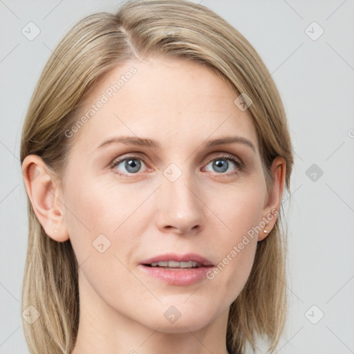 Joyful white young-adult female with long  brown hair and blue eyes