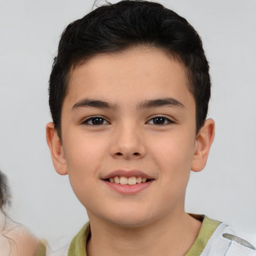 Joyful asian child male with short  brown hair and brown eyes